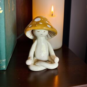 Meditating Mushroom Desk Decor – Charming Whimsical Figure with Closed Eyes and Yellow Spots, Ideal for Home, Office, or Garden.